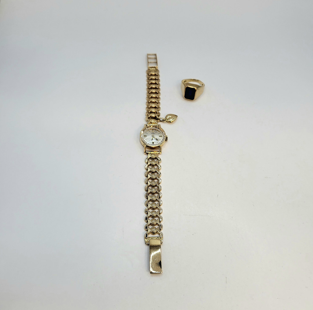 Orologio e anello oro pietra