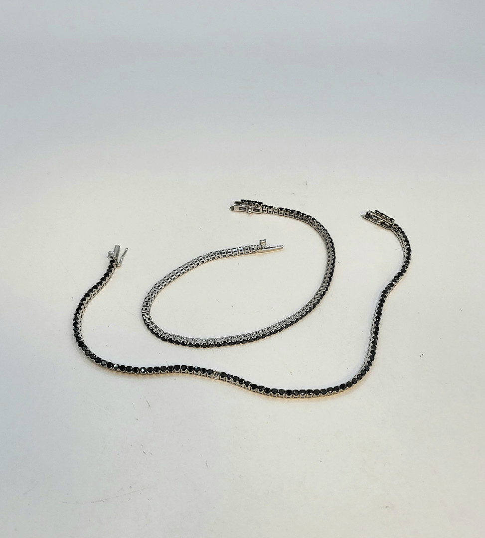 Due bracciali oro pietre 