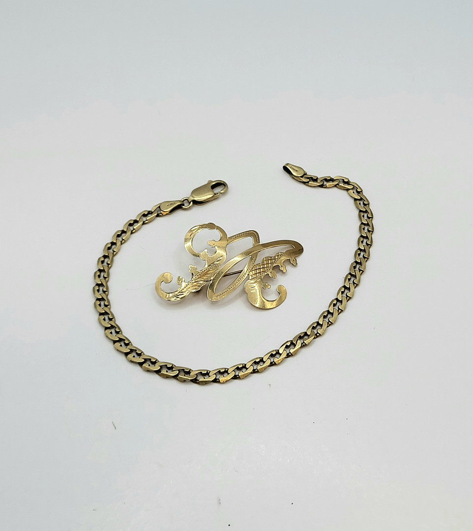 Bracciale e spilla oro