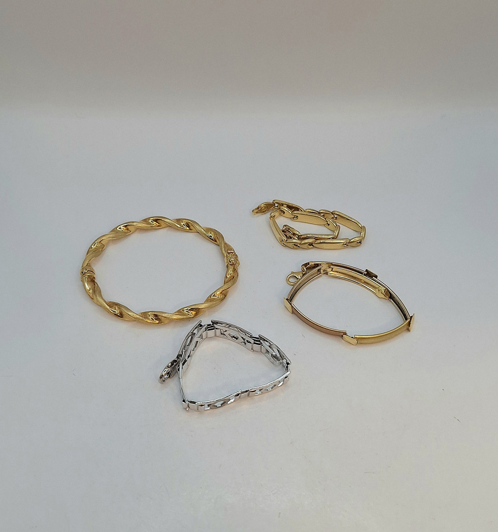 Quattro bracciali oro