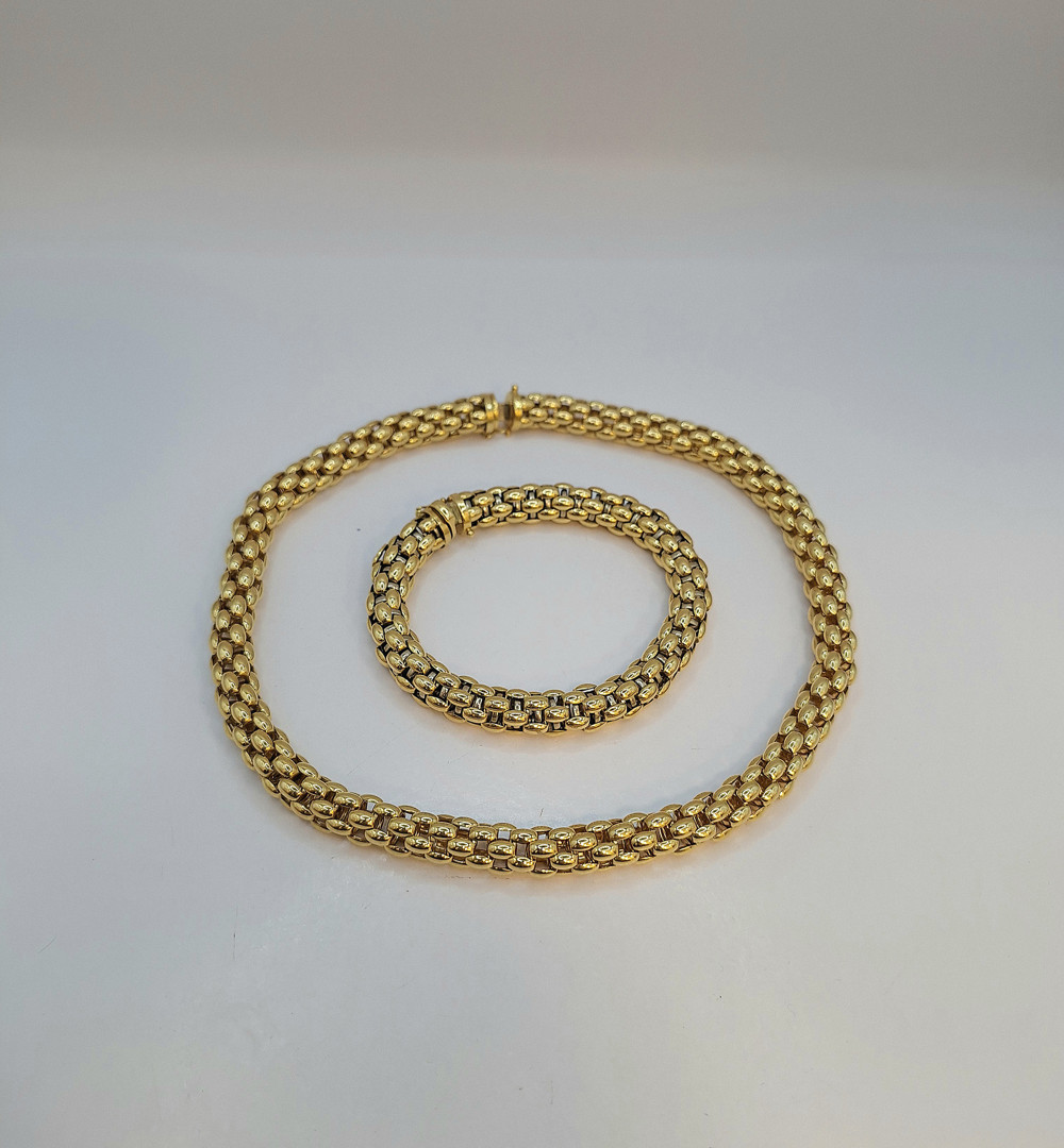 Collana e bracciale a firma Fope oro