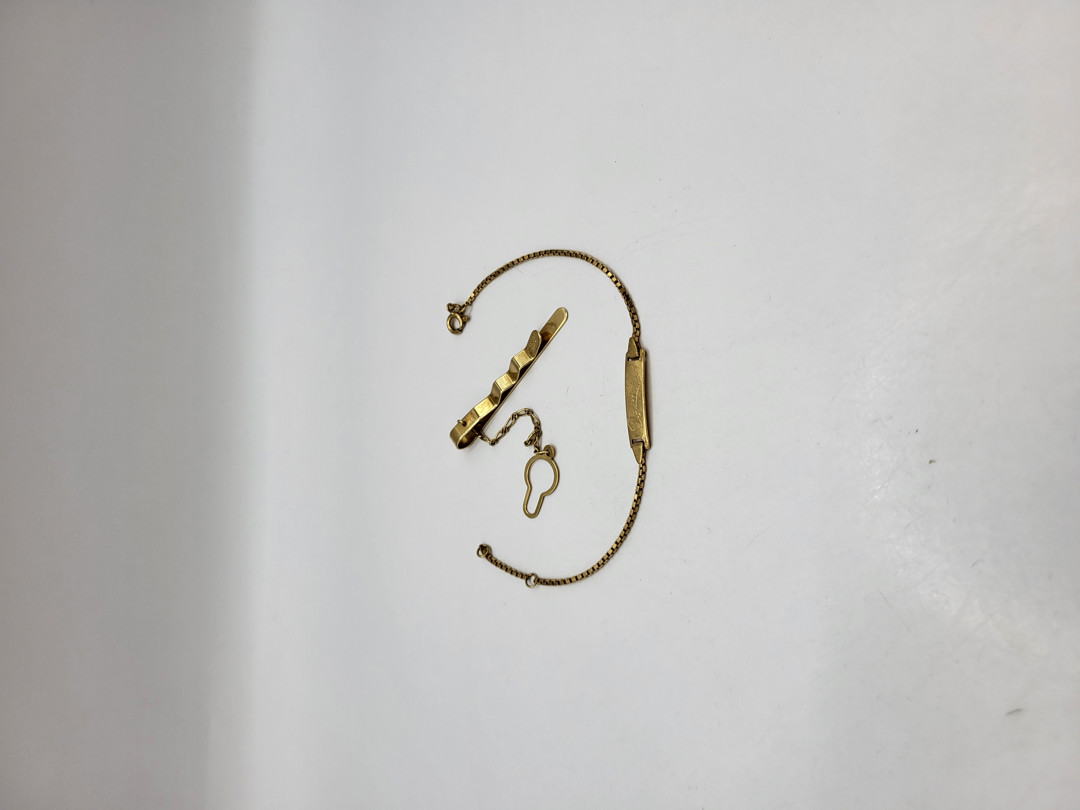 Bracciale e fermacravatta oro