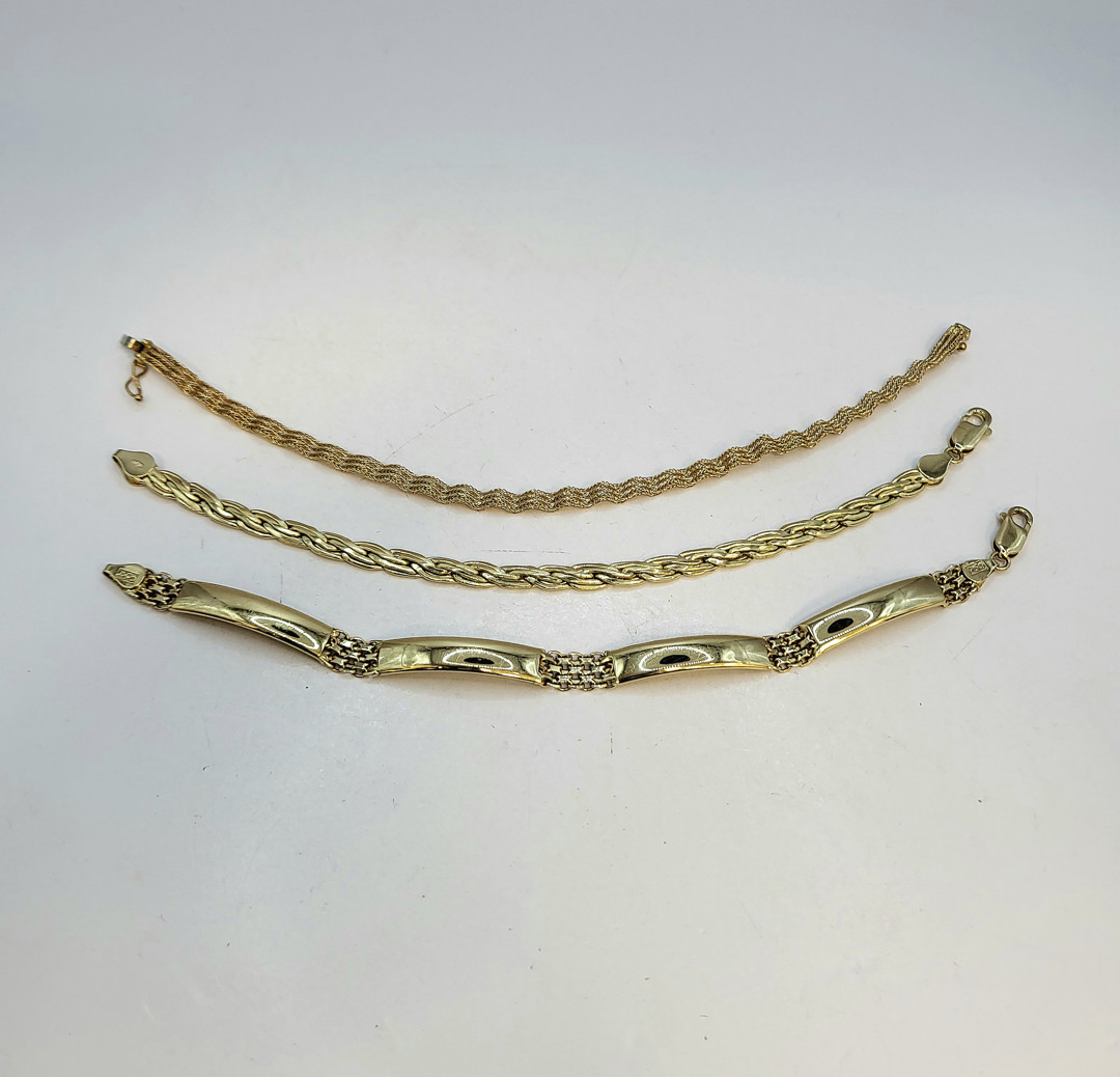 Tre bracciali oro