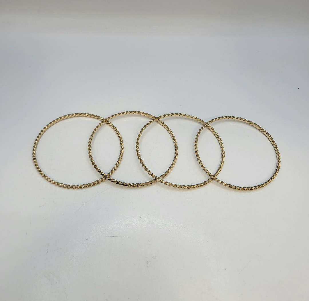 Quattro bracciali oro