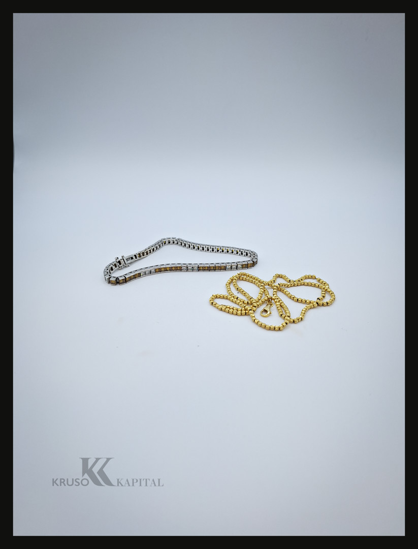 Collana e bracciale in oro platino diamanti pietre