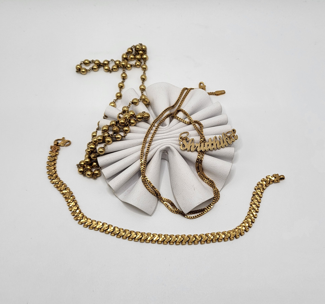Due catene bracciale e ciondolo oro pietre 