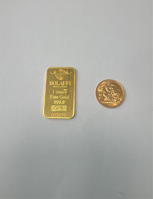 Moneta e lingottino oro 