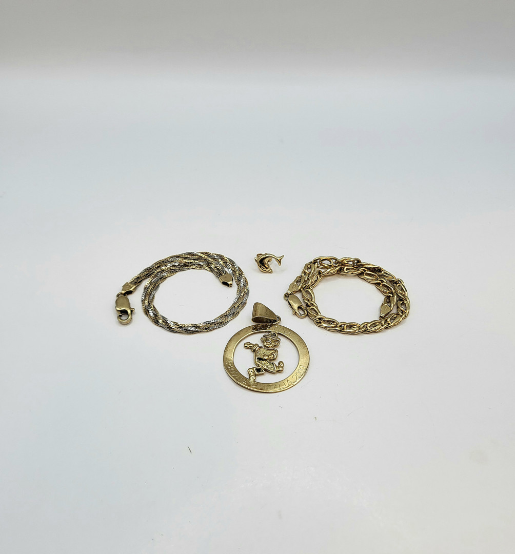 Due bracciali ciondolo orecchino oro
