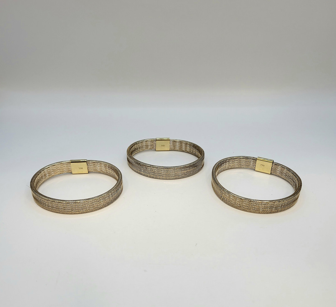 Tre bracciali oro