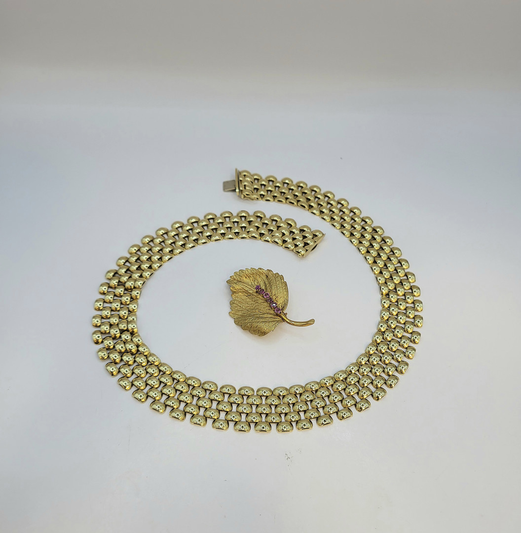 Collana e spilla oro pietre