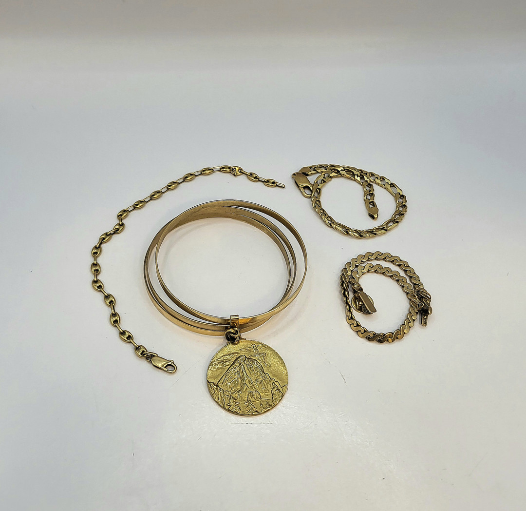 Quattro bracciali oro