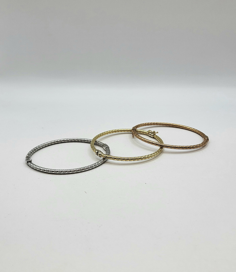 Tre bracciali oro 