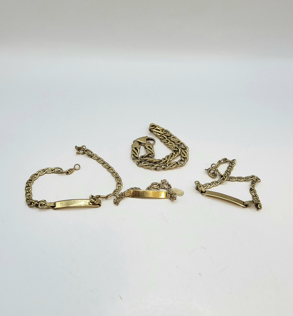 Quattro bracciali oro 