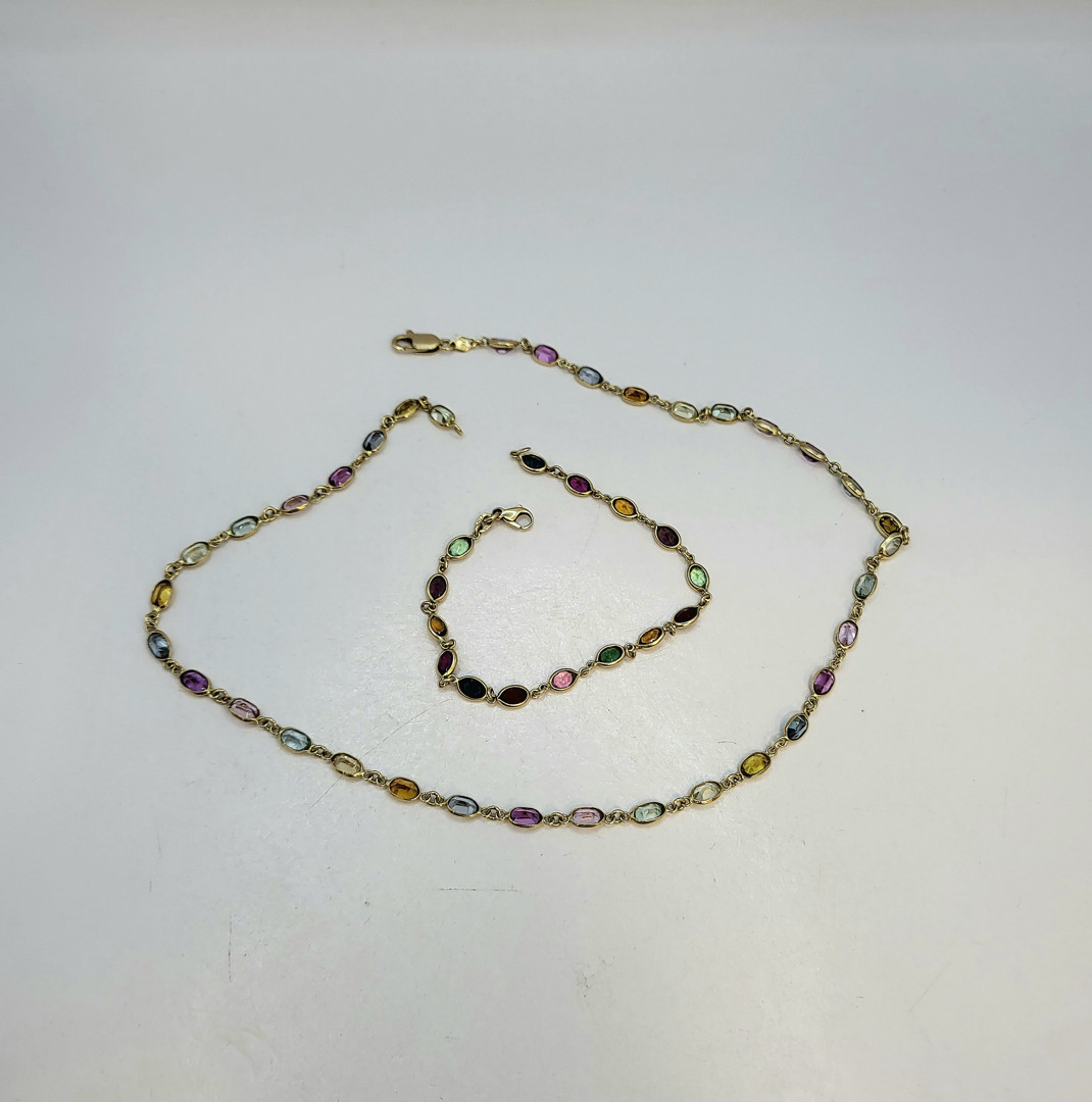 Collana e bracciale oro pietre