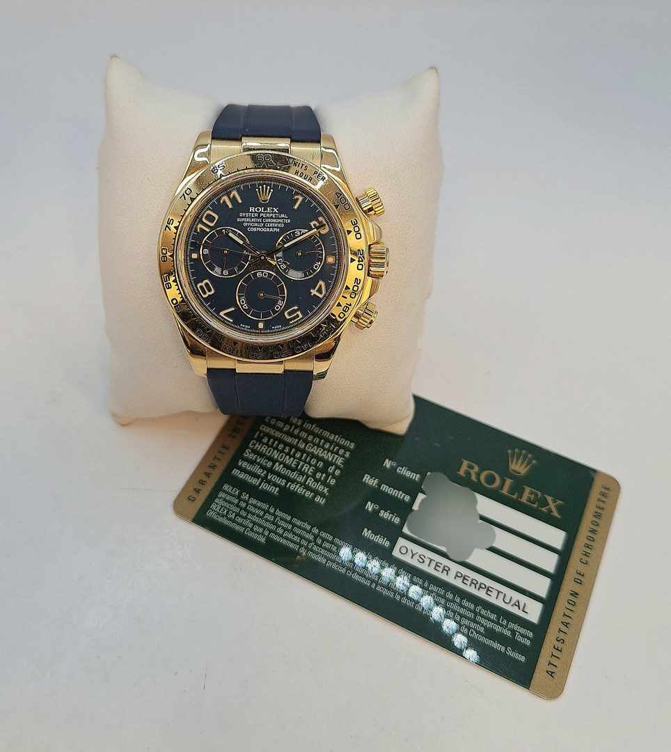 Cronografo oro Rolex Daytona con cinturino in gomma e fibbia deployante con garanzia a corredo