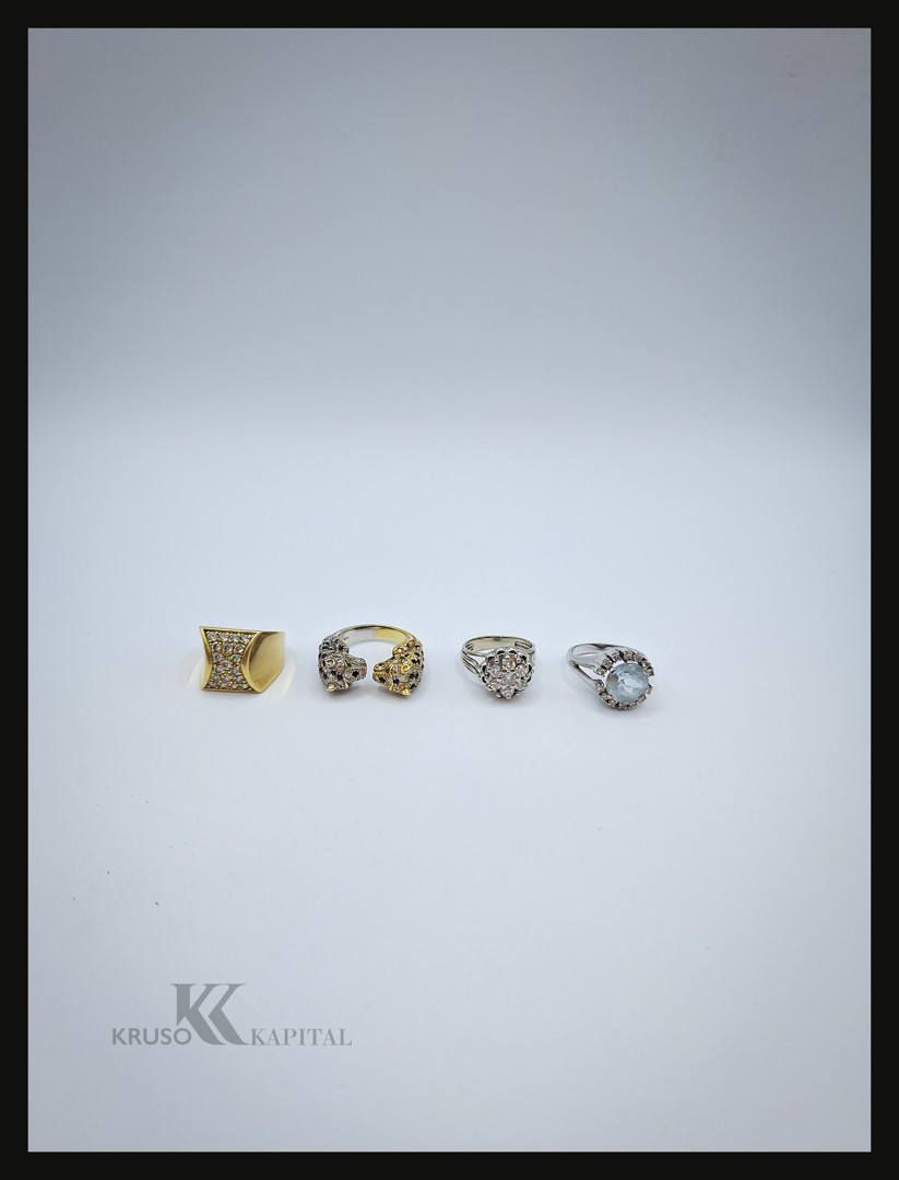Quattro anelli oro pietre diamantini