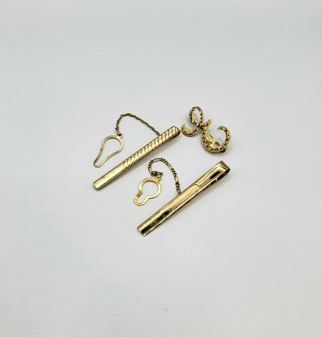 Due fermacravatte e spilla oro