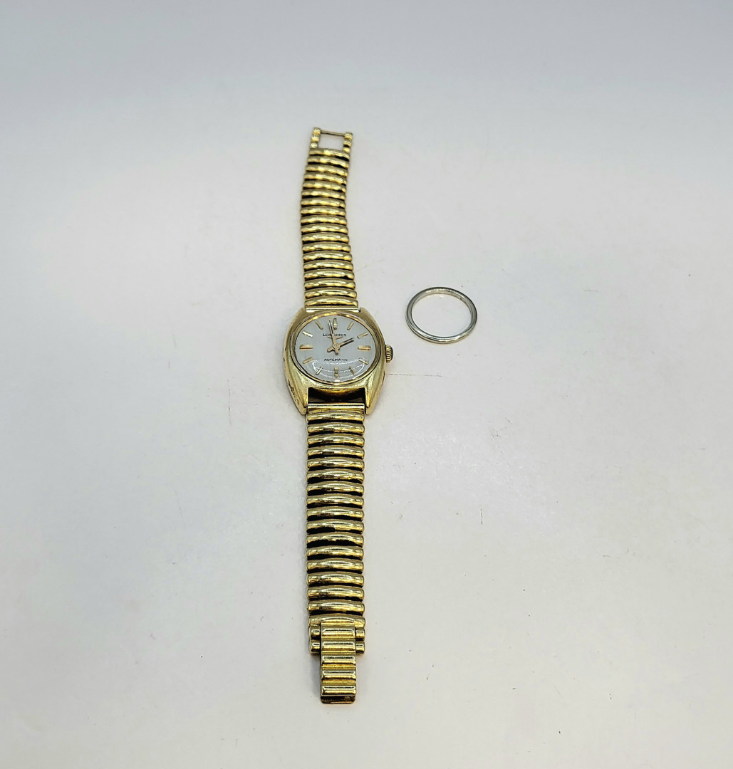 Fermanello e orologio oro