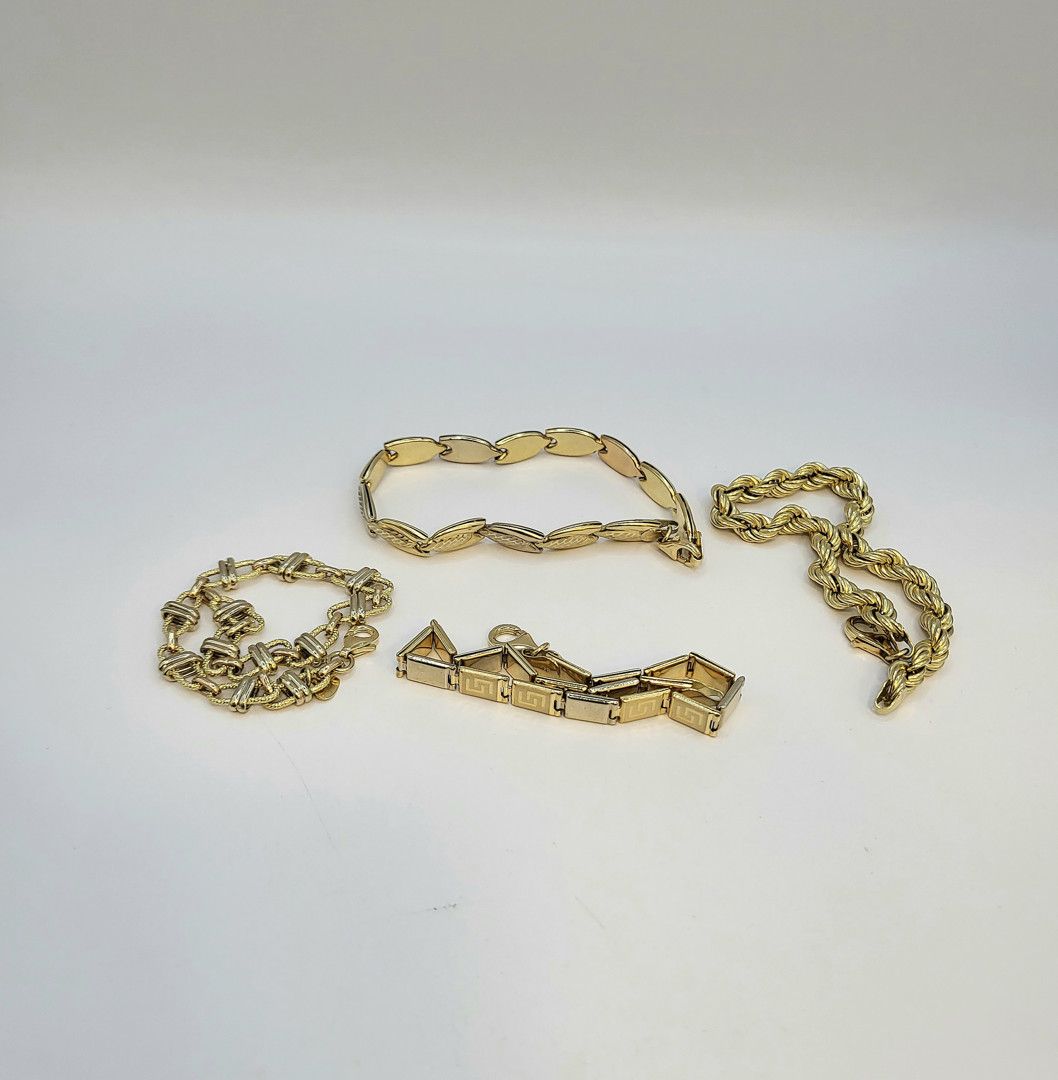 Quattro bracciali oro