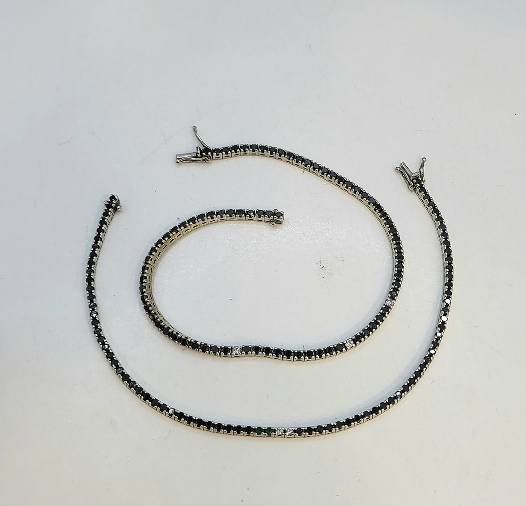 Due bracciali oro pietre diamantini