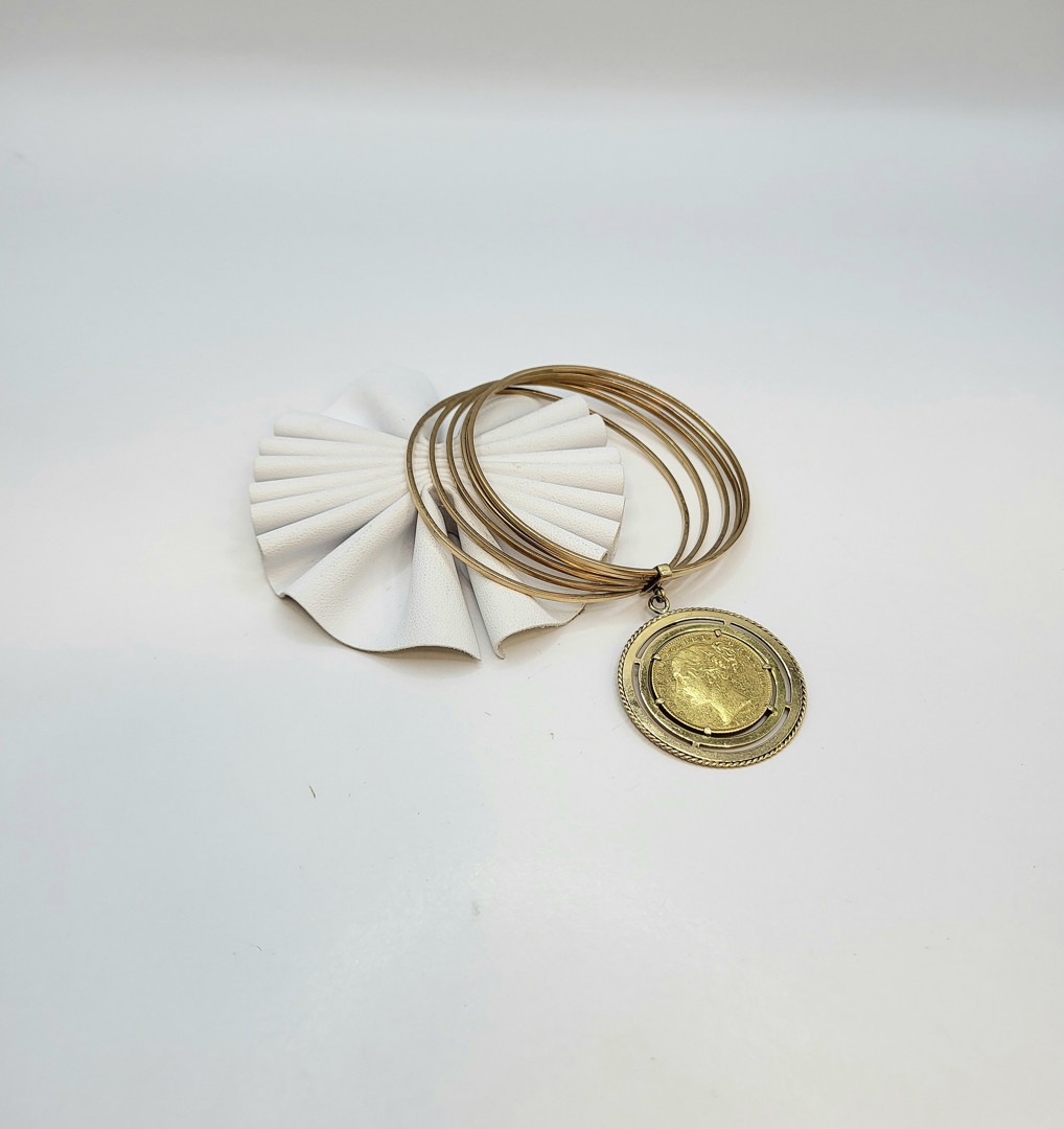 Bracciale con sterlina oro