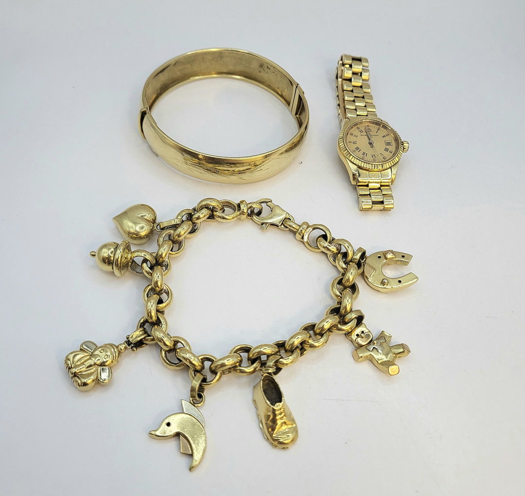 Bracciale con orologio e bracciali oro