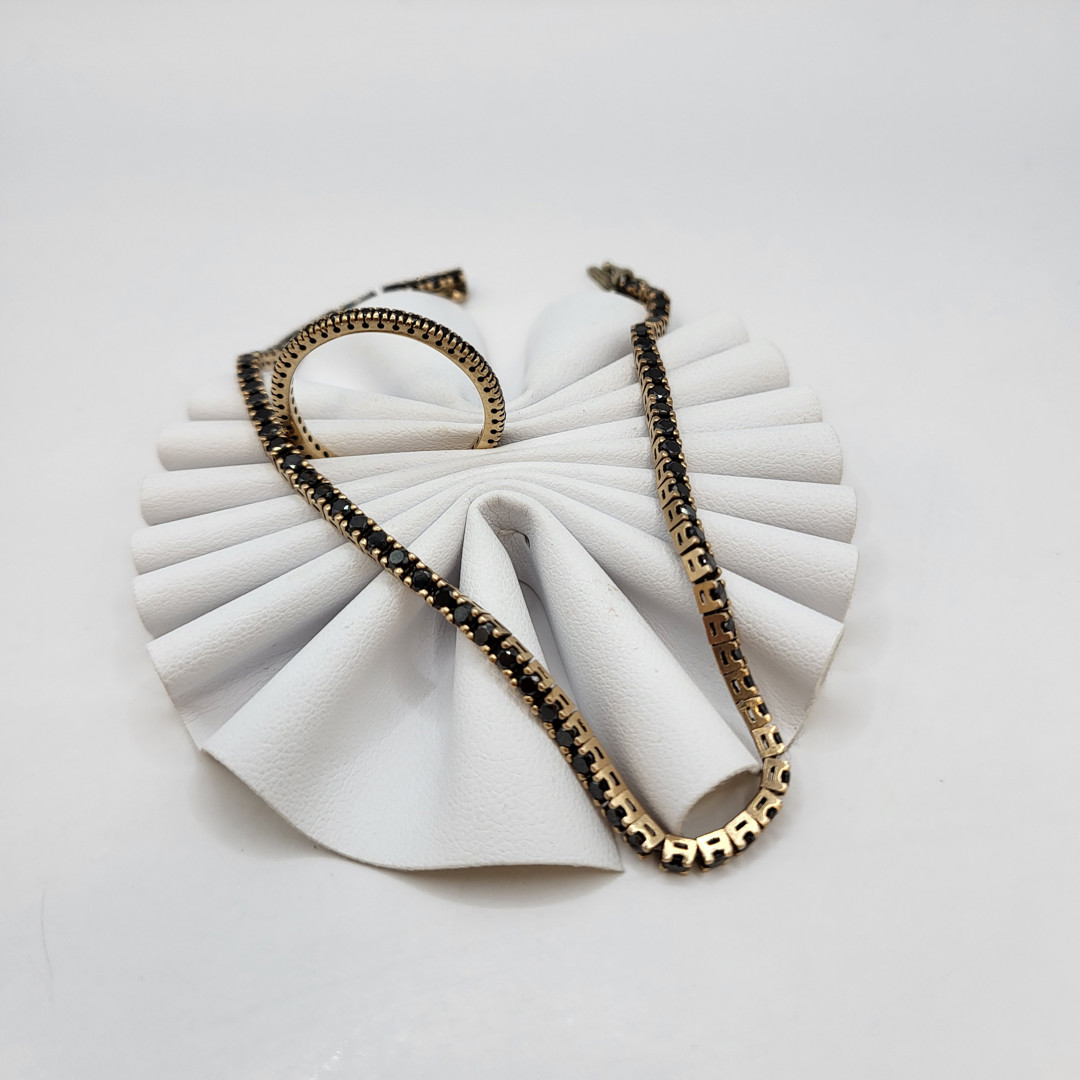 Bracciale e anello oro pietre