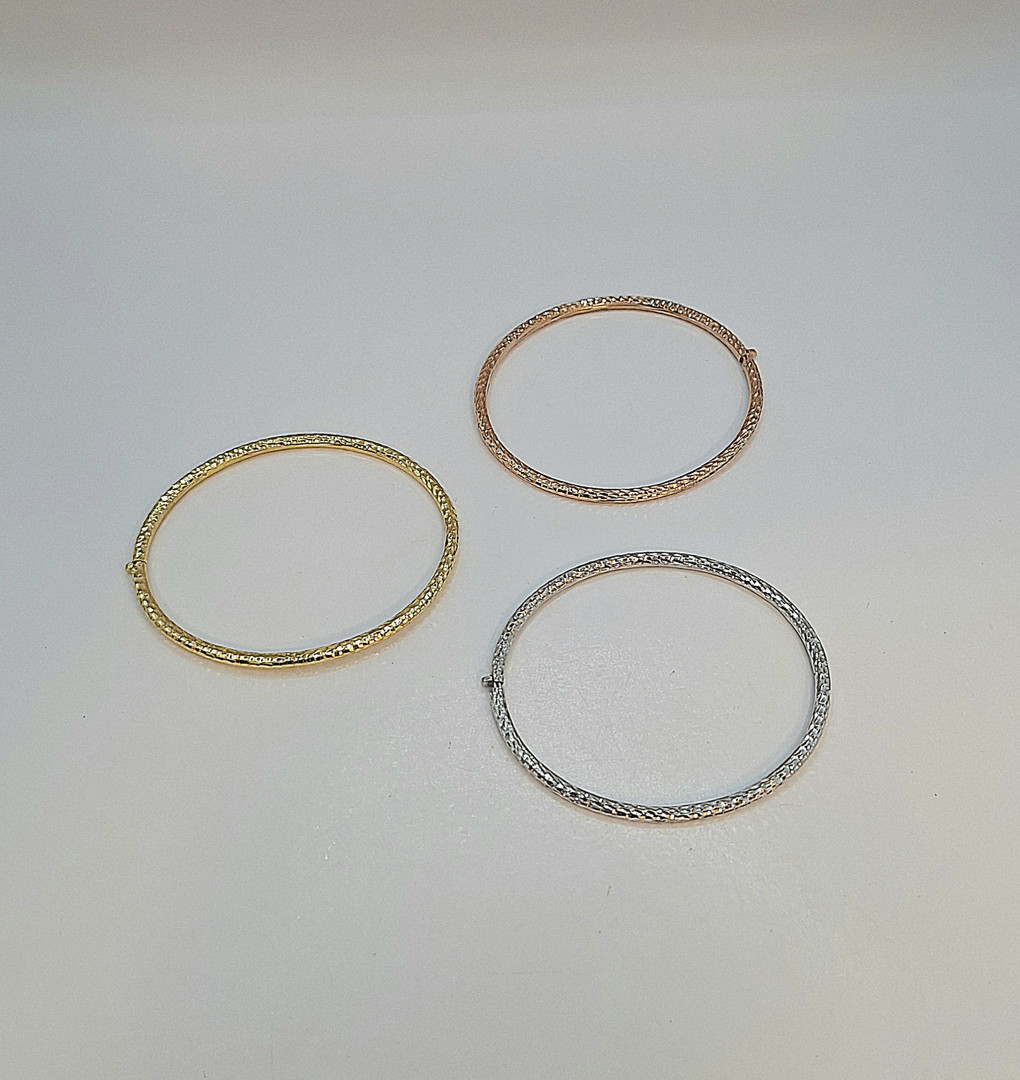 Tre bracciali oro
