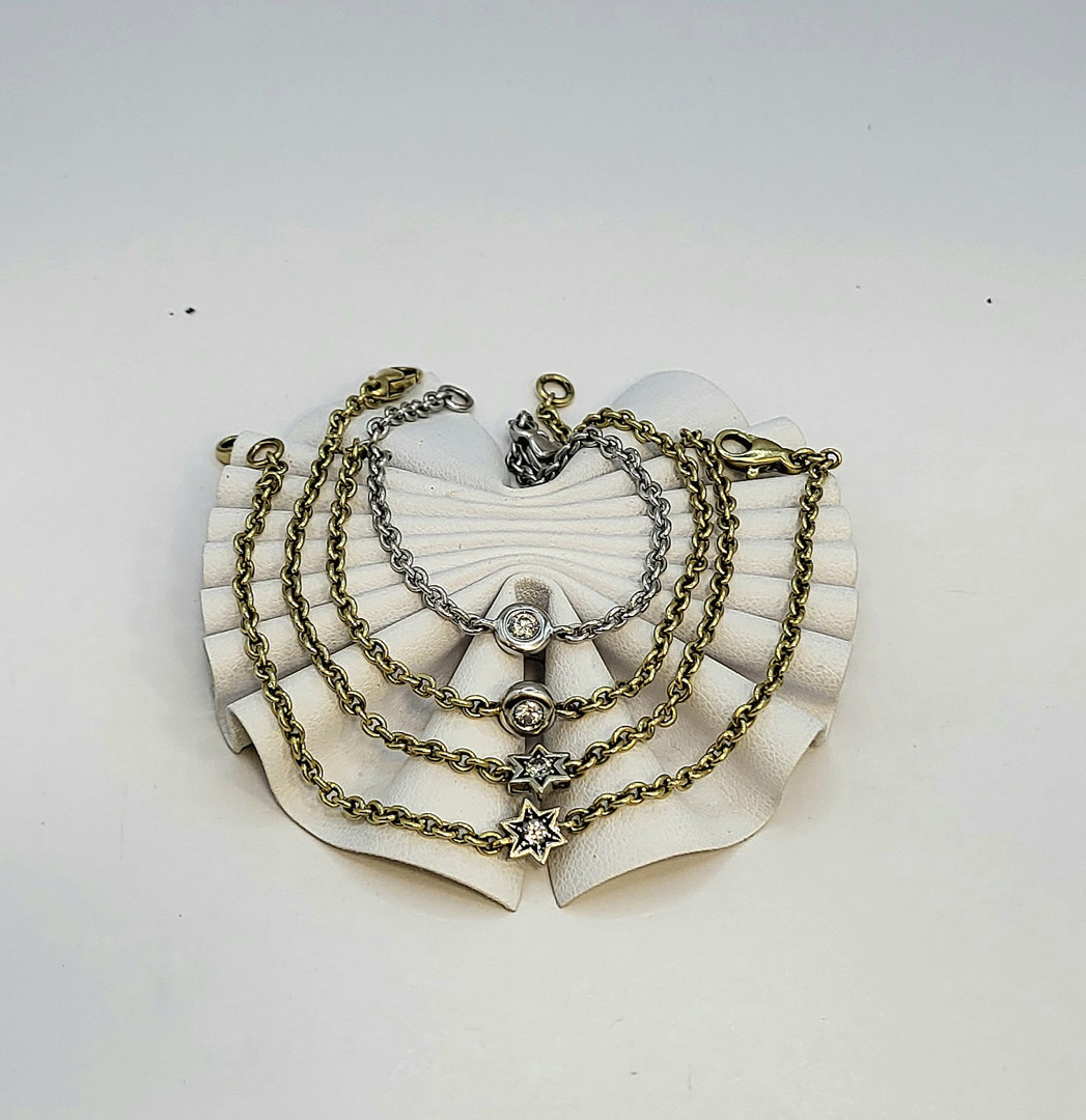Quattro bracciali oro diamantini