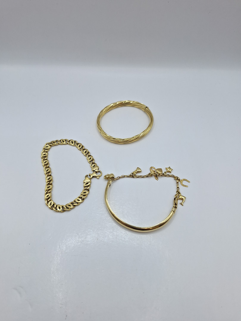 Tre bracciali oro 