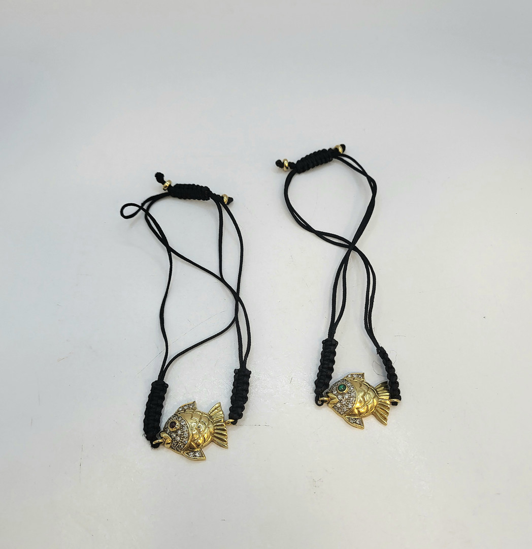 Due bracciali oro diamanti pietre tessuto