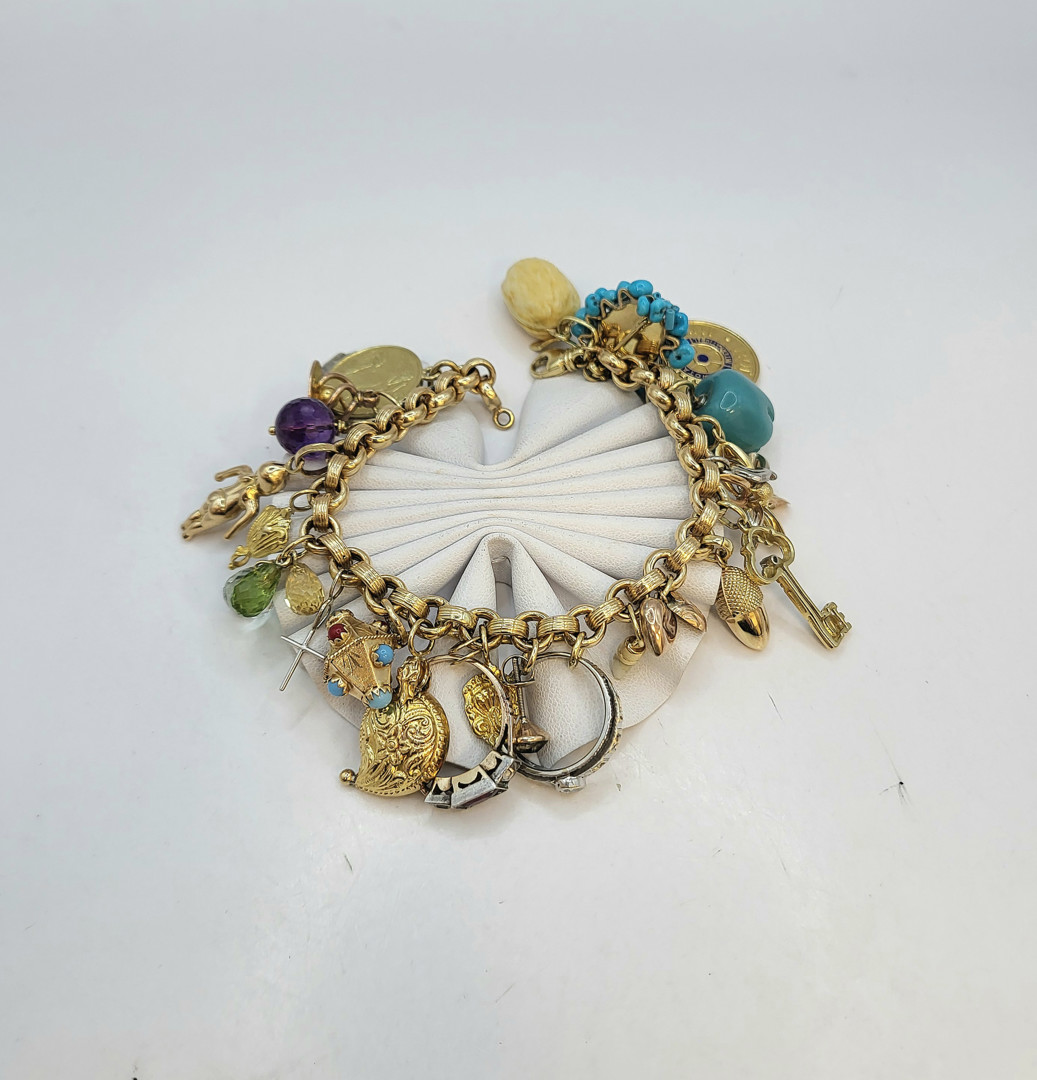 Bracciale con ciondoli oro argento pietre