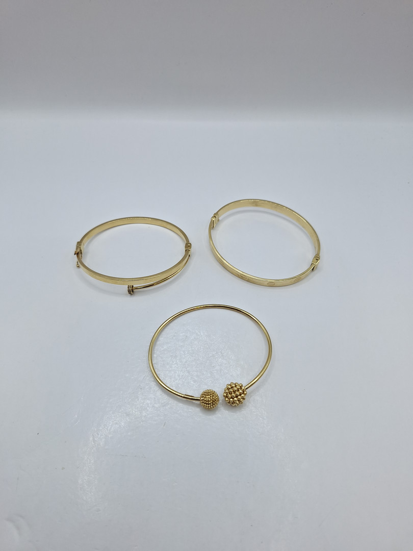 Tre bracciali oro 