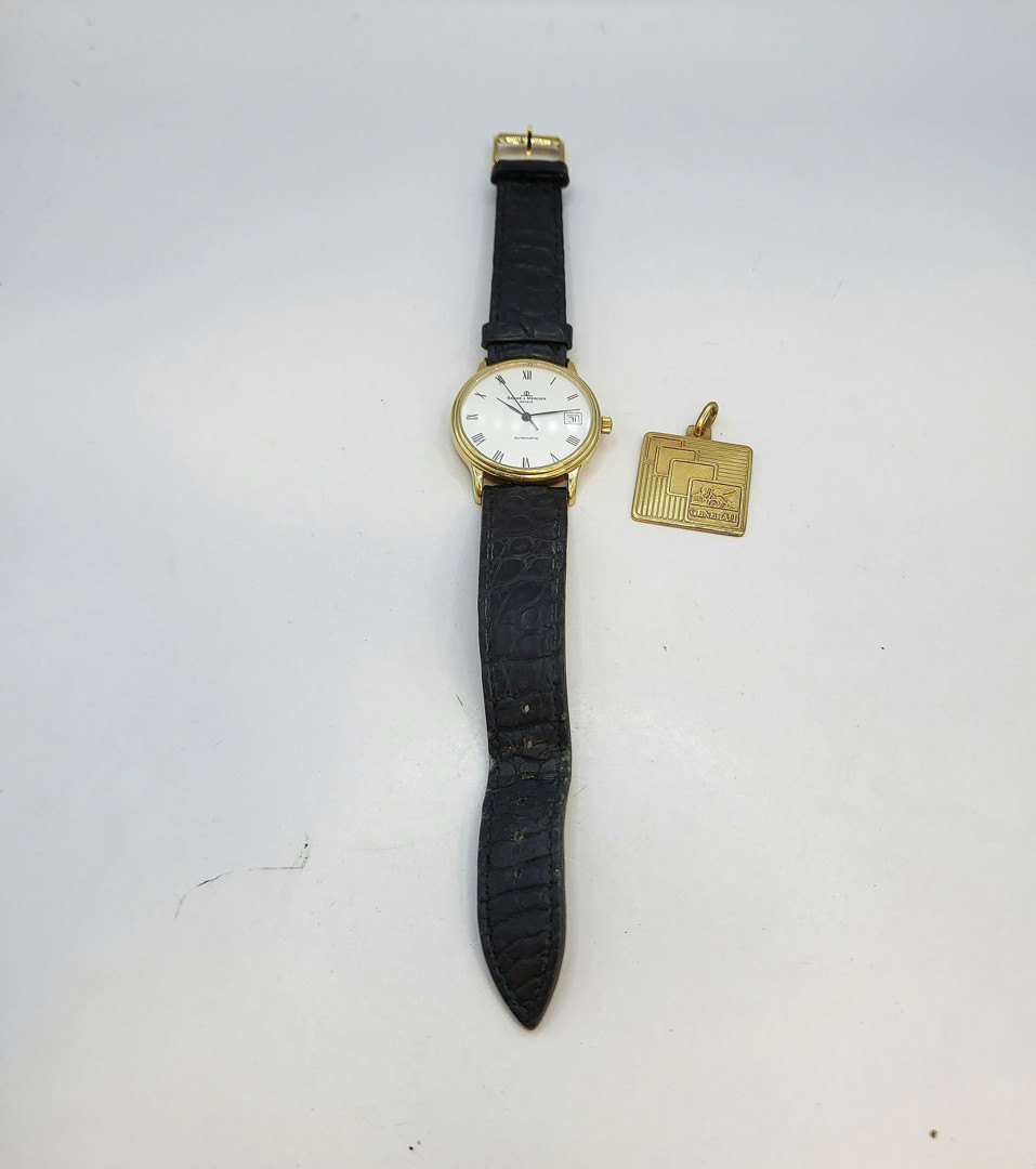 Orologio Baume & Mercie e medaglia oro