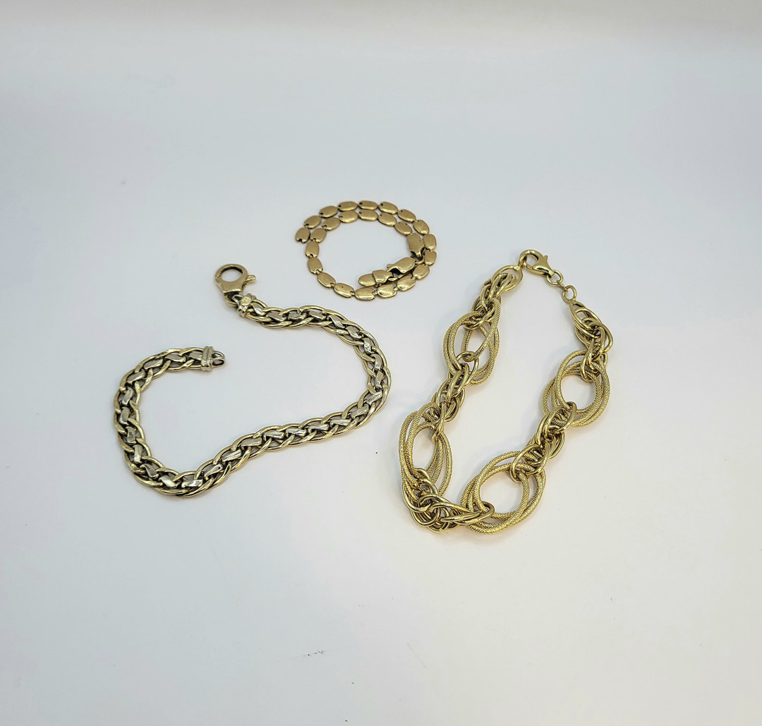 Tre bracciali oro