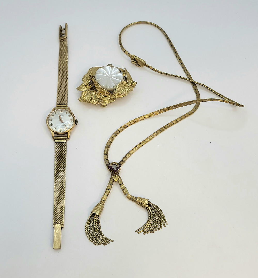 Collana spilla orologio bracciale oro pietre