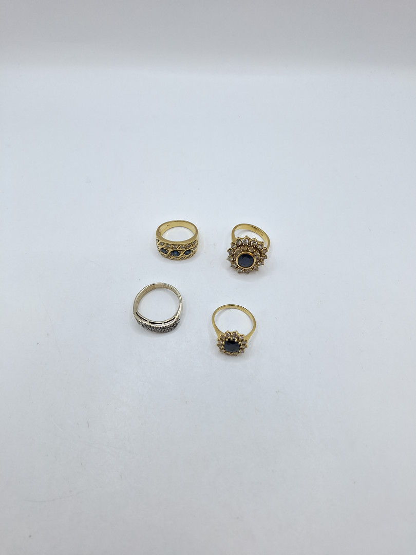 Quattro anelli oro pietre diamanti