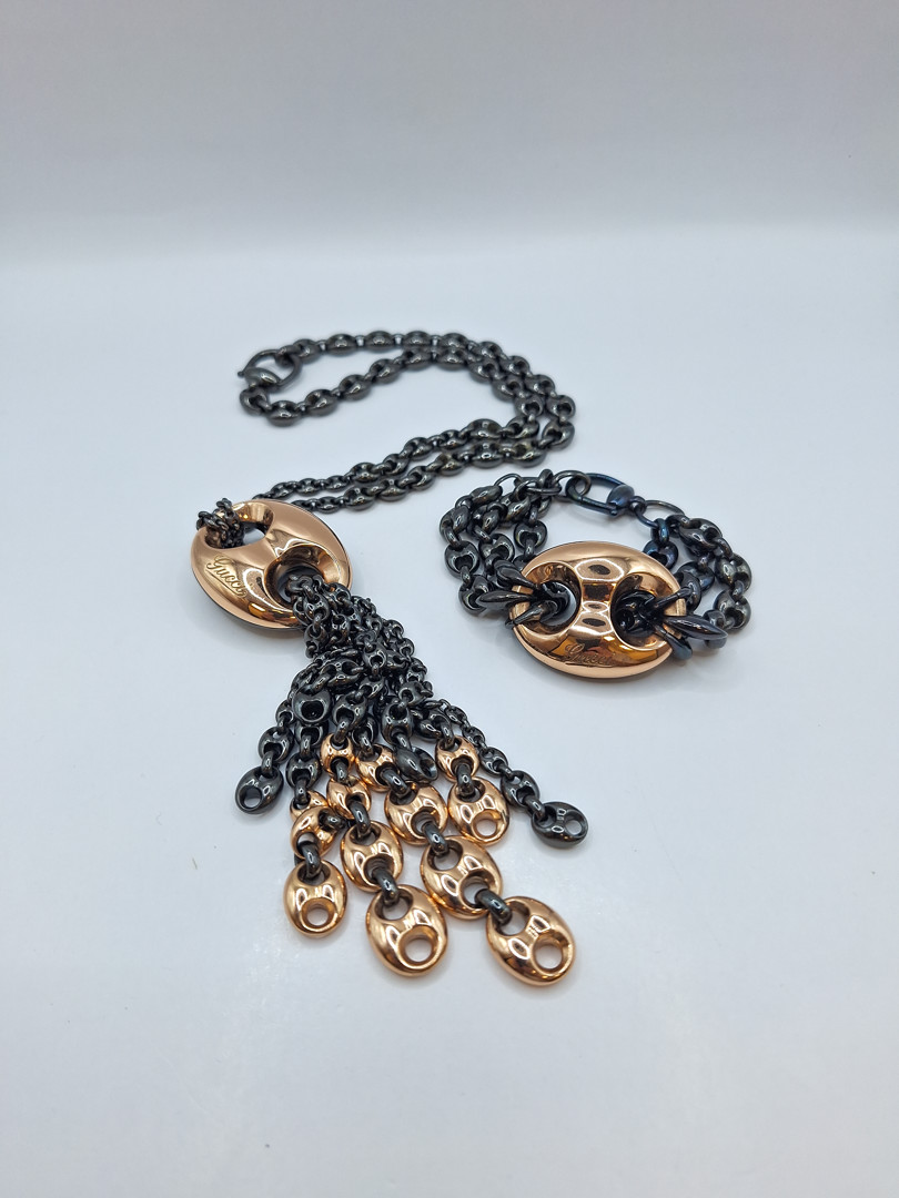 Collana e bracciale a firma Gucci oro metallo