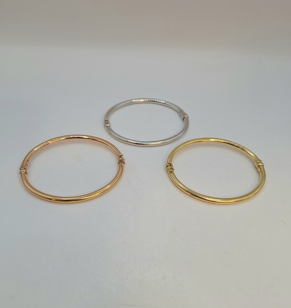 Tre bracciali oro 