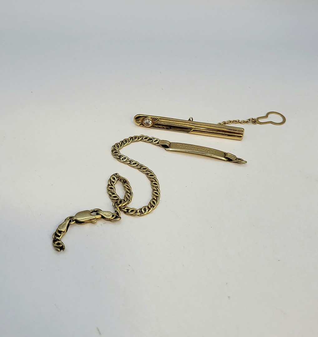 Fermacravatta e bracciale oro pietra 