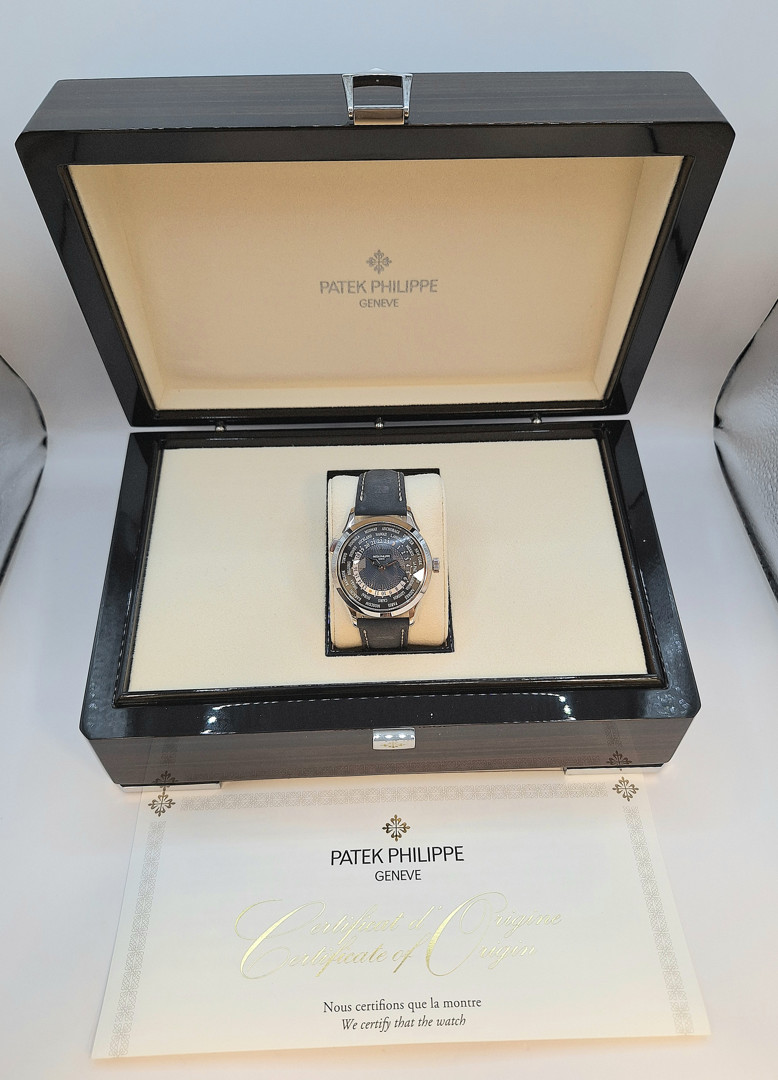 Orologio e fibbia deployante platino Patek Philippe World Time scatola e garanzia a corredo