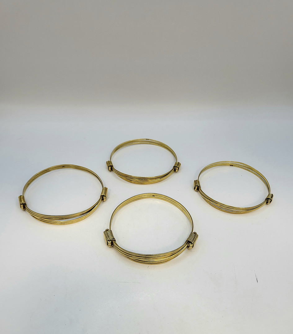 Quattro bracciali oro