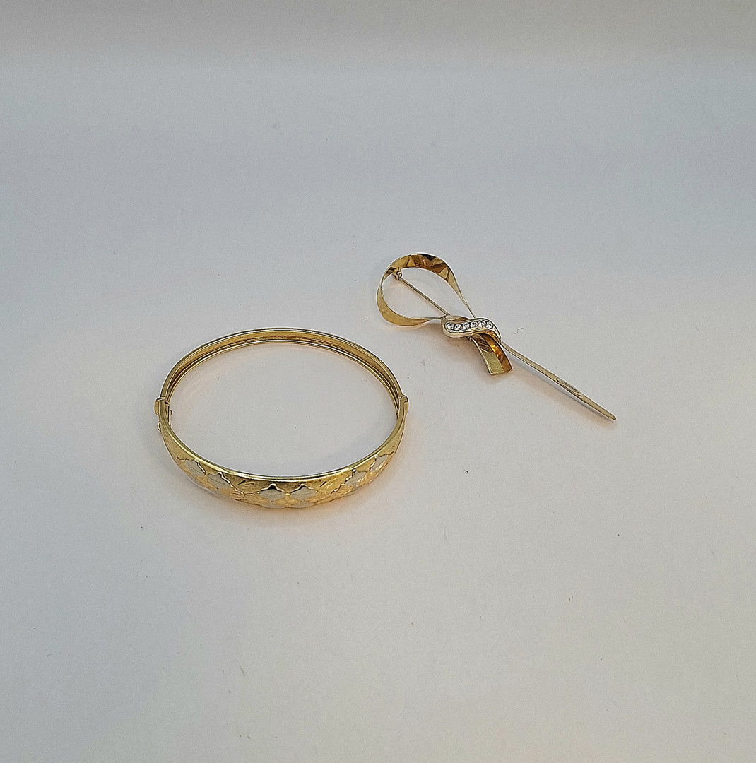 Bracciale e spilla oro pietre