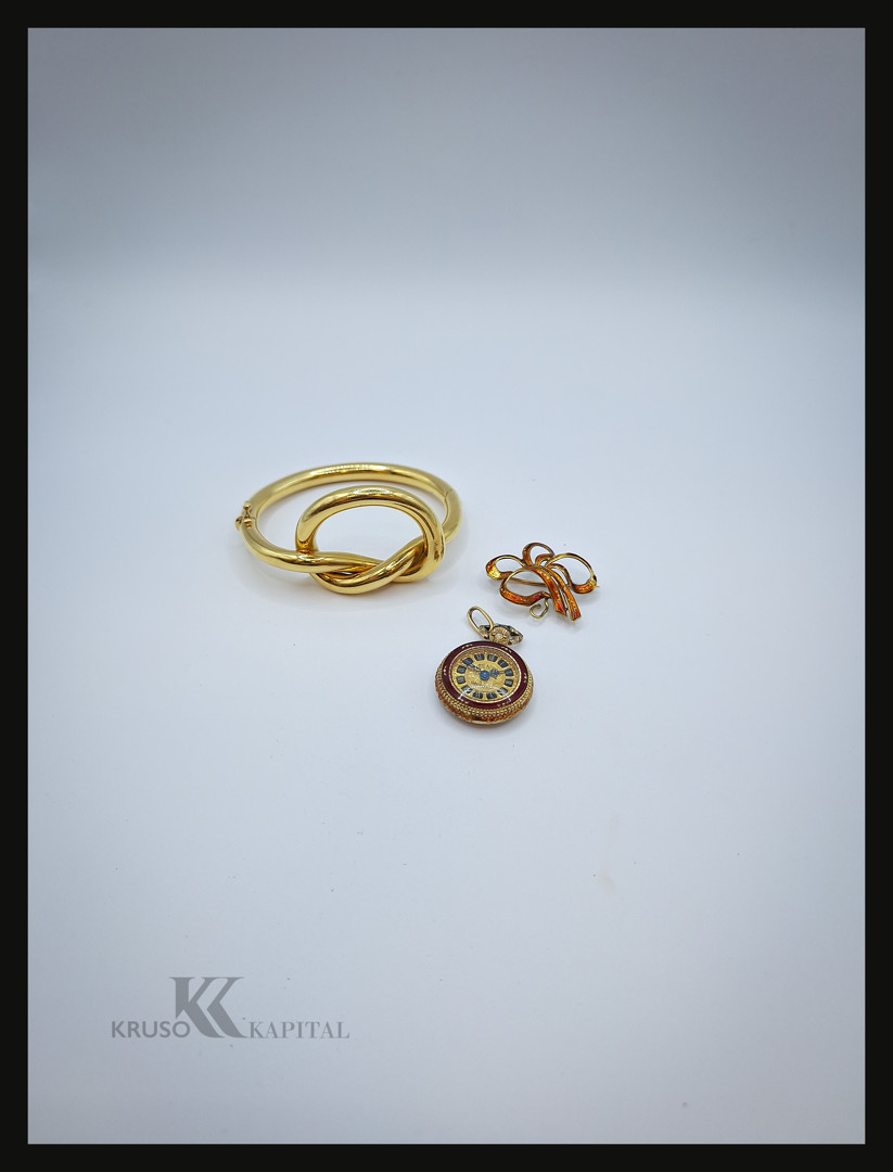 Bracciale e spilla in oro e orologio