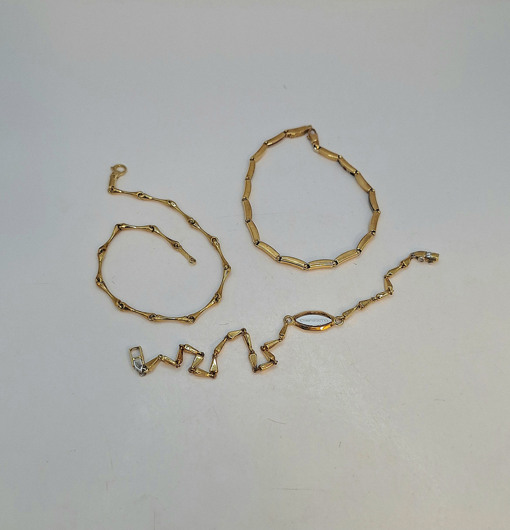 Tre bracciali oro 