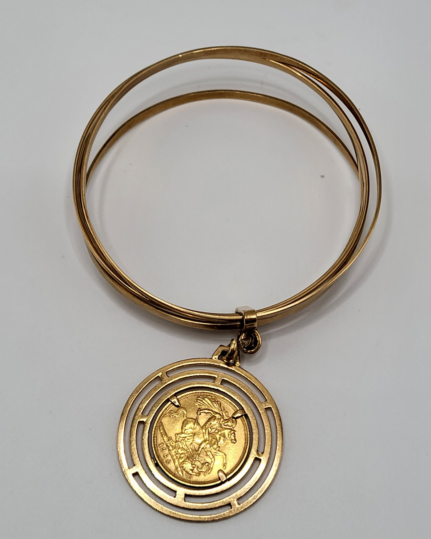 Bracciale e ciondolo con moneta oro 