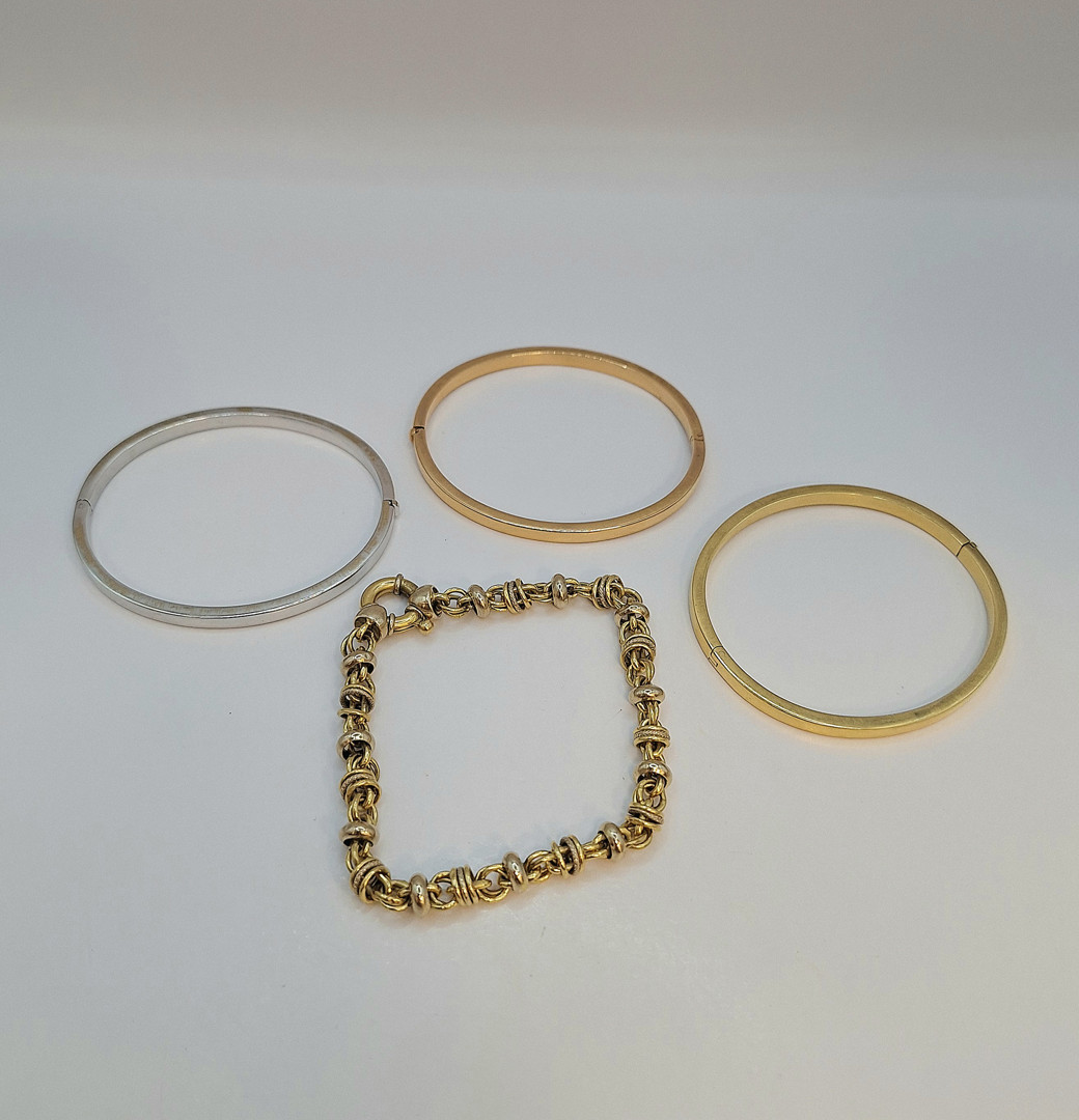 Quattro bracciali oro