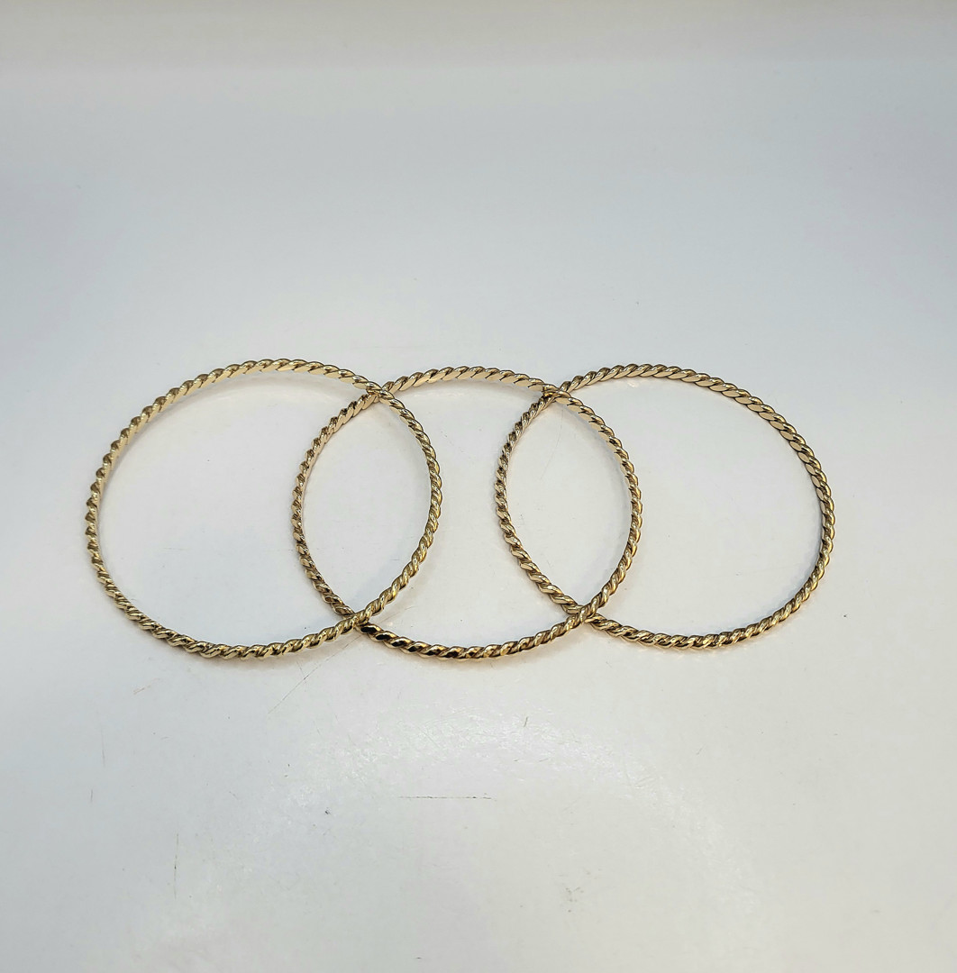 Tre bracciali oro