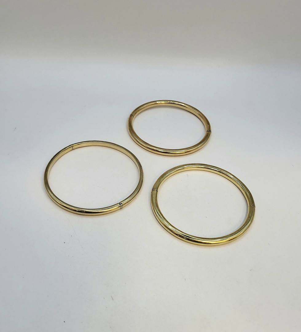 Tre bracciali oro