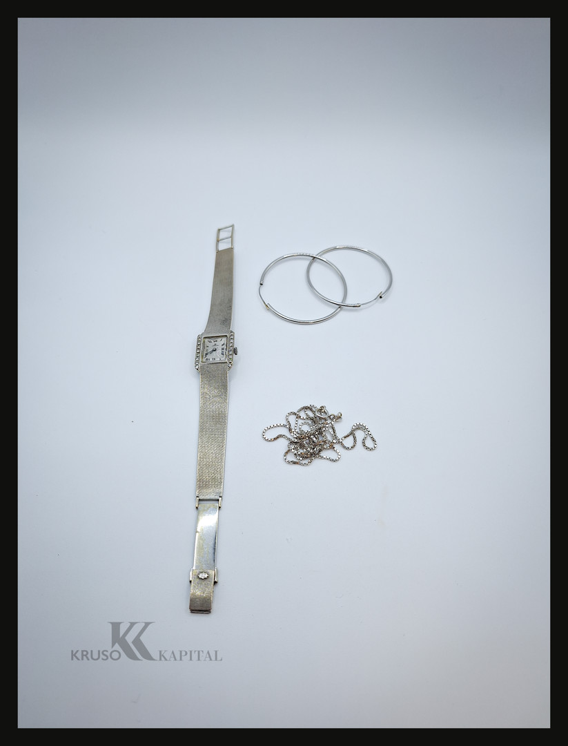 Un paio orecchini catena orologio e bracciale oro diamanti 